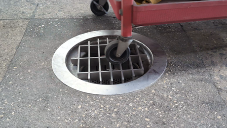 floor drain with hand cart rolling over it