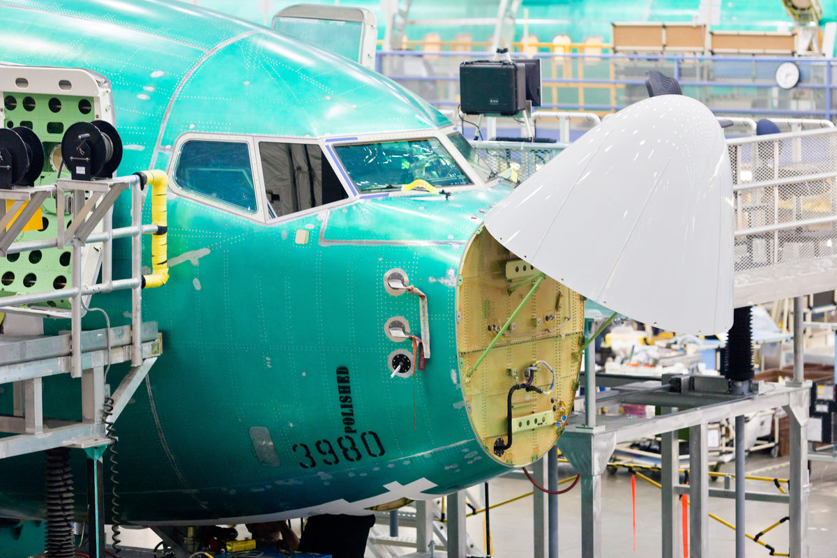 Airplane being built in manufacturing facility