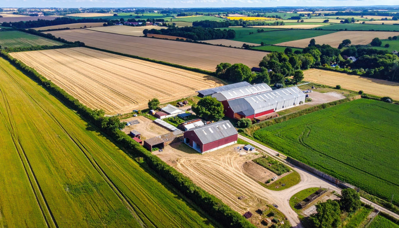 Aerial view of farmland with barn