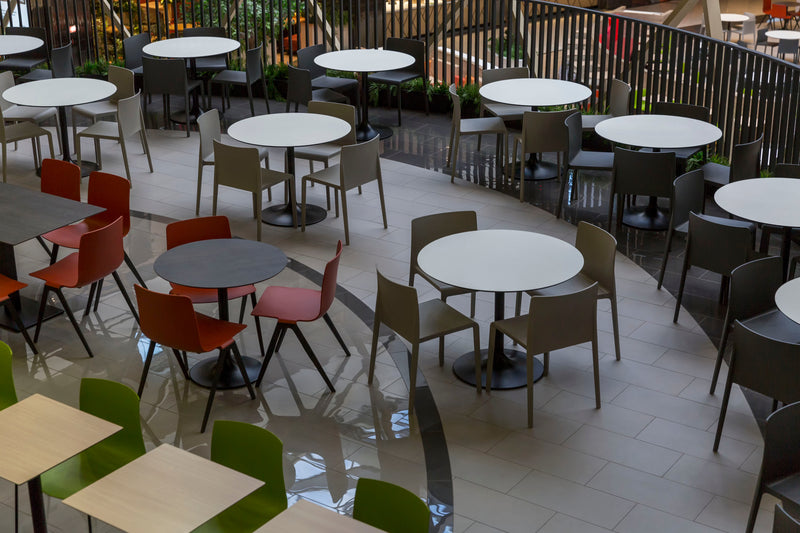 Multi-colored seating and table options at a food court