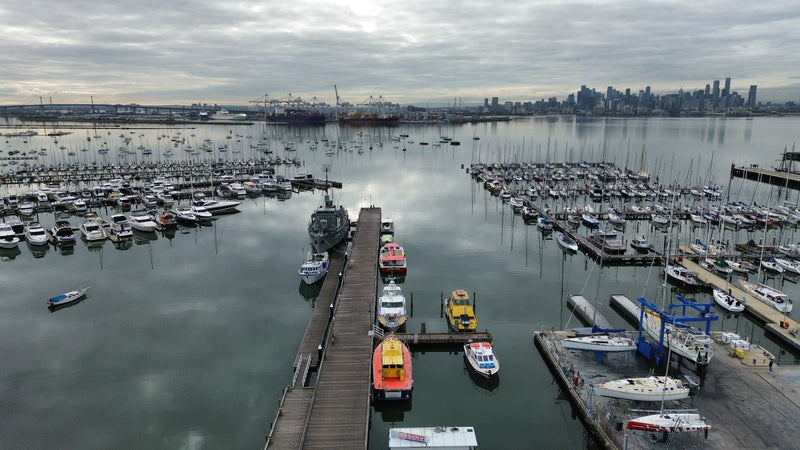 Aerial view of a marina with many small watercraft vessels.