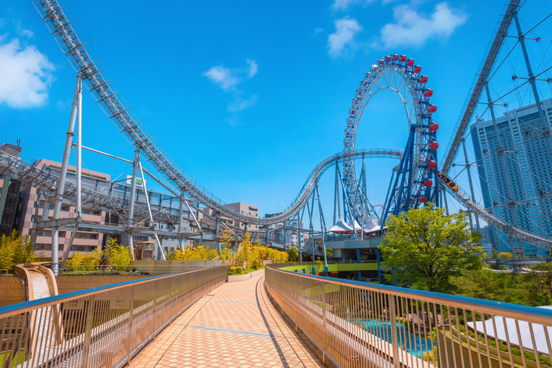Walkway in front of a large rollercoaster amusement park