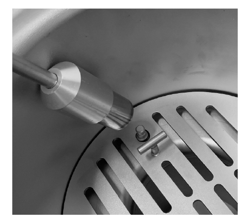 Maglock being removed from the tamper-proof strainer
