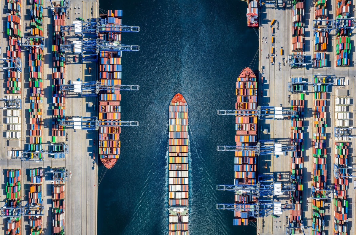 3 ships carrying shipping containers at marine port
